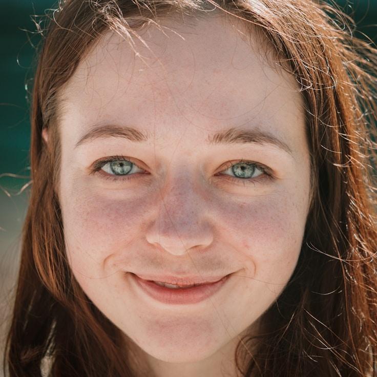 Kaveri Mehta, Lead Design Curator at Meadow Glass Field, reviewing corporate floral arrangements